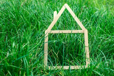 stock-photo-model-house-made-on-green-grass-81485273.jpg